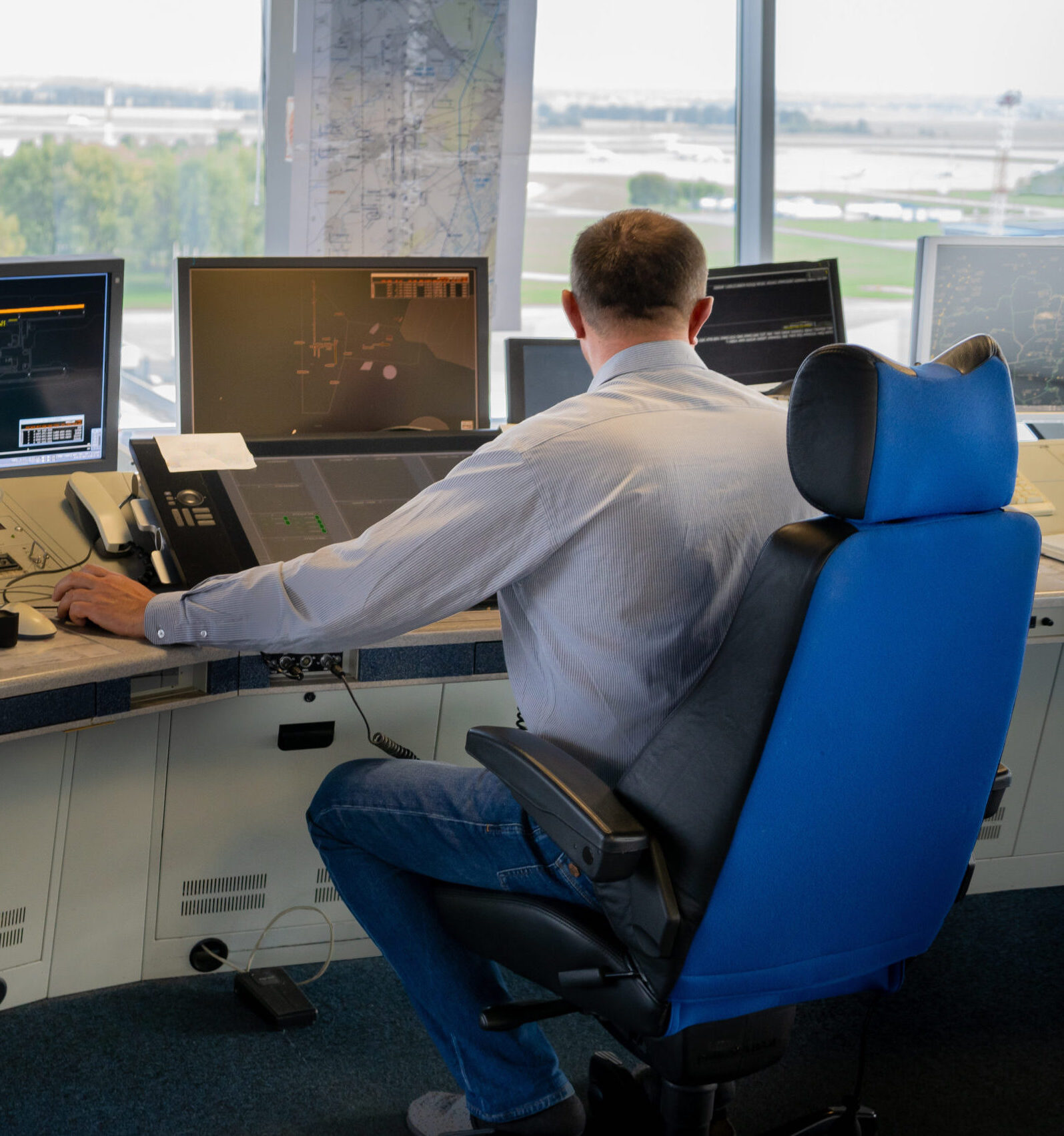 Air traffic controller workplace. Work space of the manager of takeoffs and landings of aircraft at the airport in tower. Monitors, chairs, computers. Air control center office. Unique job.